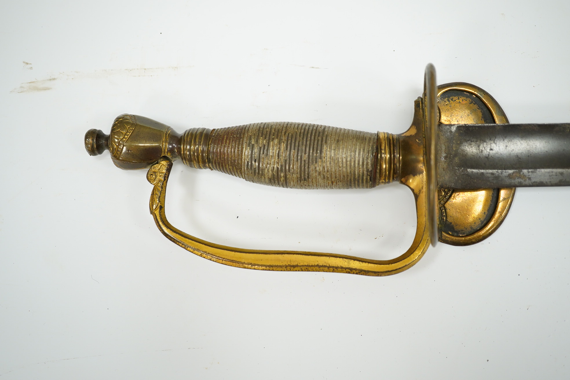 A 1796 pattern infantry officer's sword with regulation single edge blade, hilt with traces of gilding. Condition - fair, grip covering and quillon incomplete.